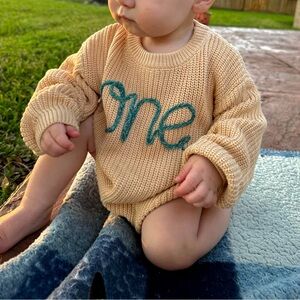 Amazon Beige Knit Sweater with Teal 'one' Embroidery